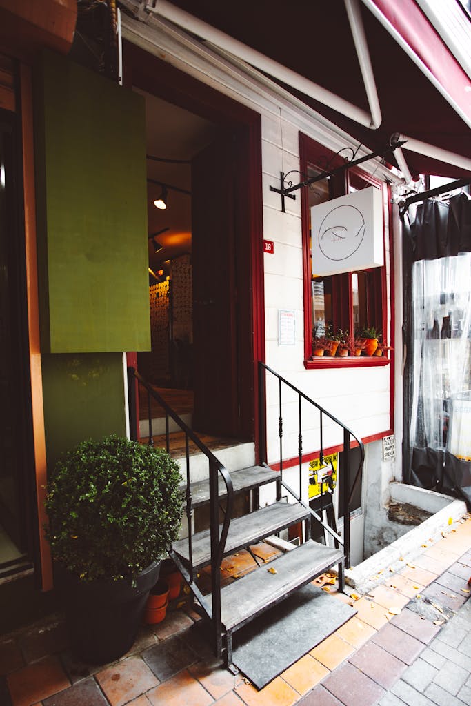 Vertical Shot of a Cafe Entrance with a Shade